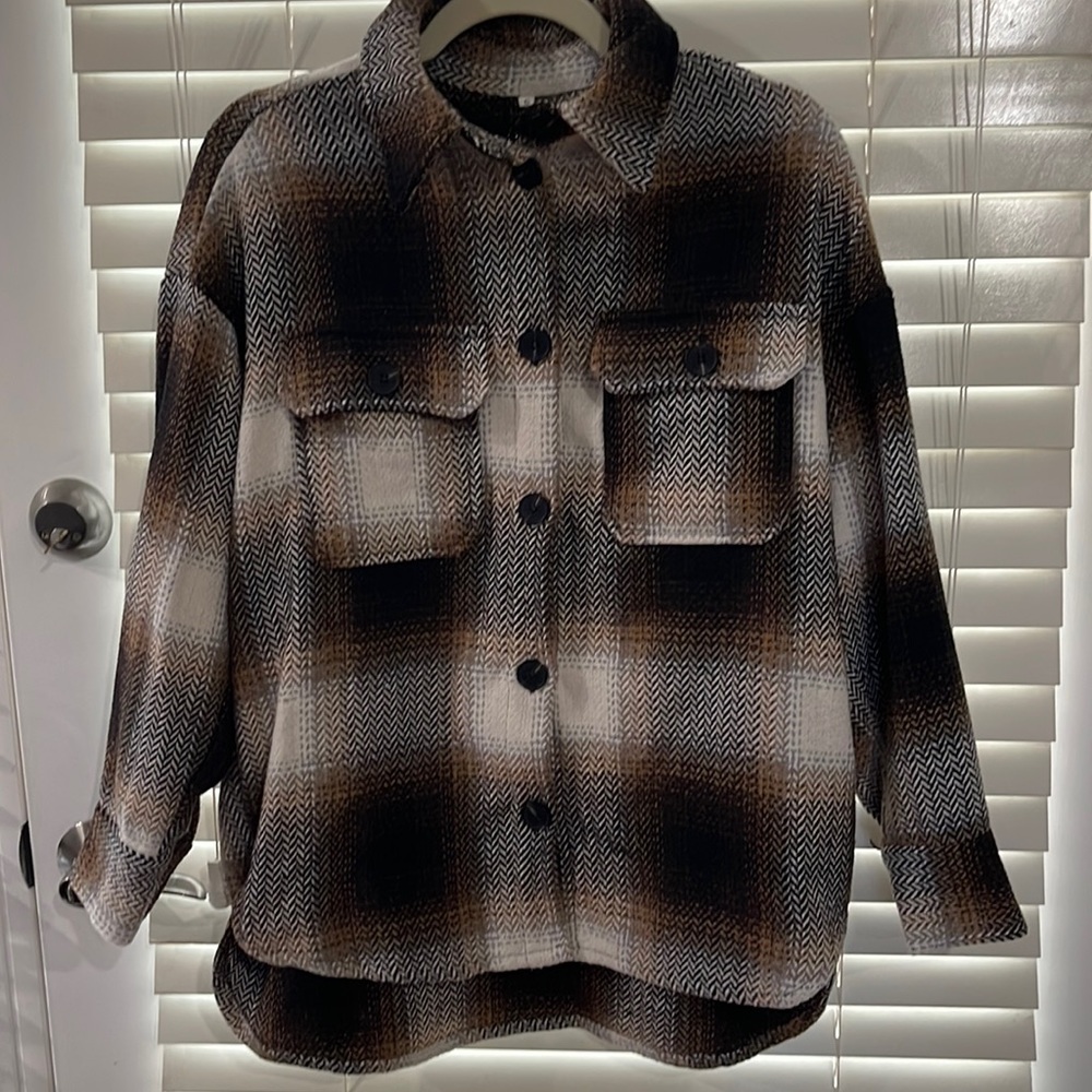 Dark brown, tan, and cream shaket . Size small good condition